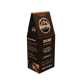 ROOFERS COFFEE Skylight light roast 12 oz coffee box, three-quarter view showing the story side and artwork